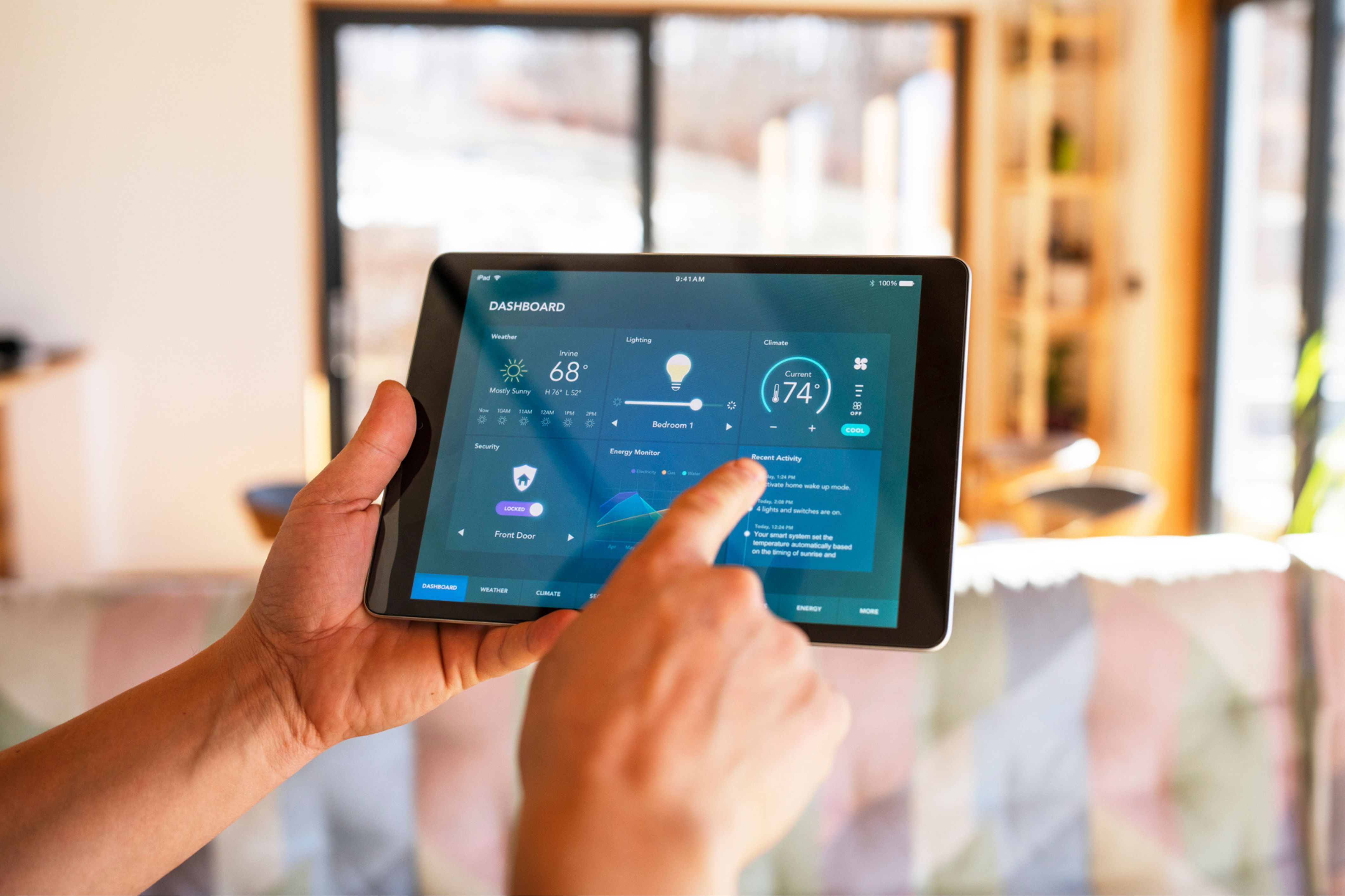 A person uses a tablet to make their home a smart home.