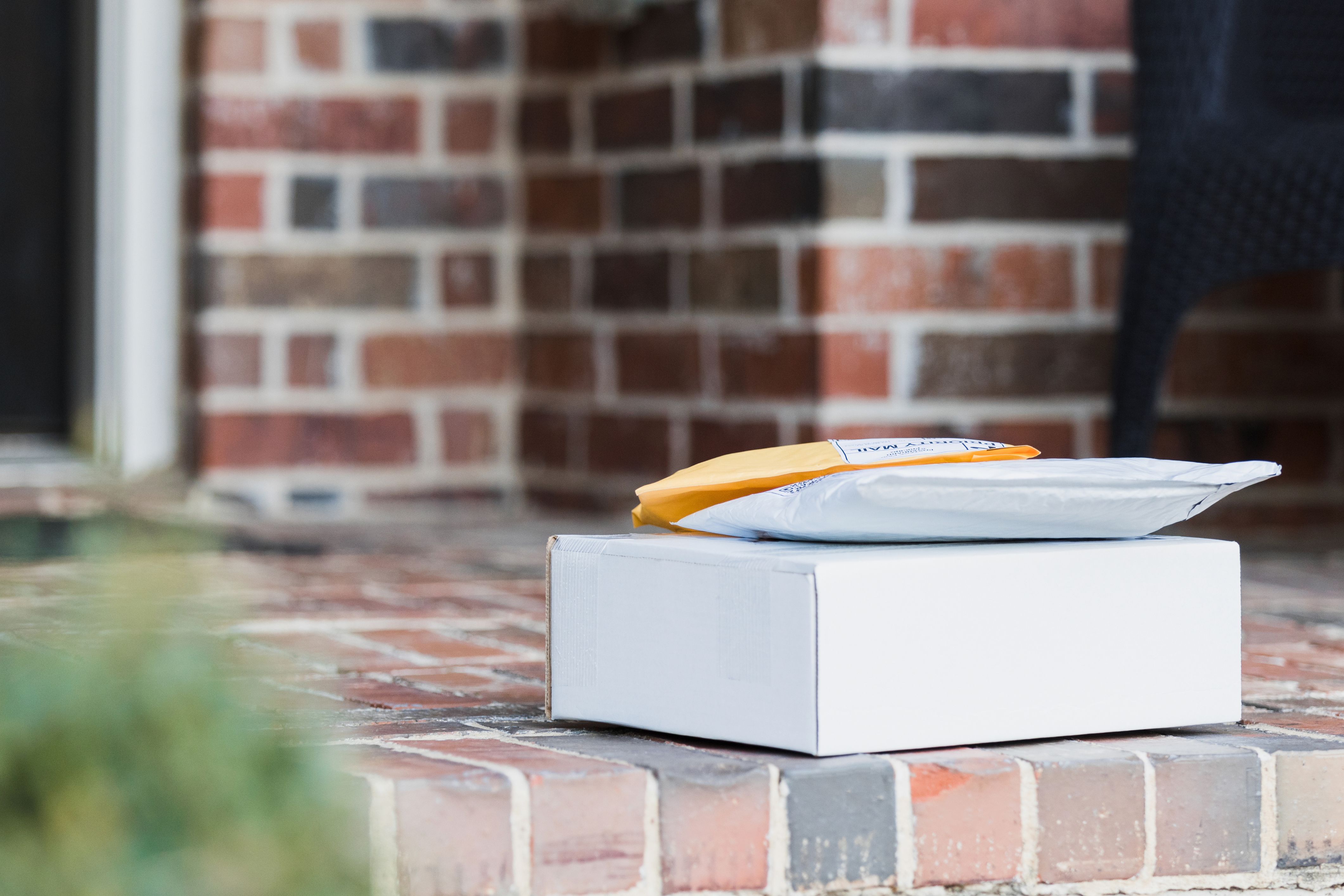 Packages waiting on a step in a community need to be protected from porch pirates.