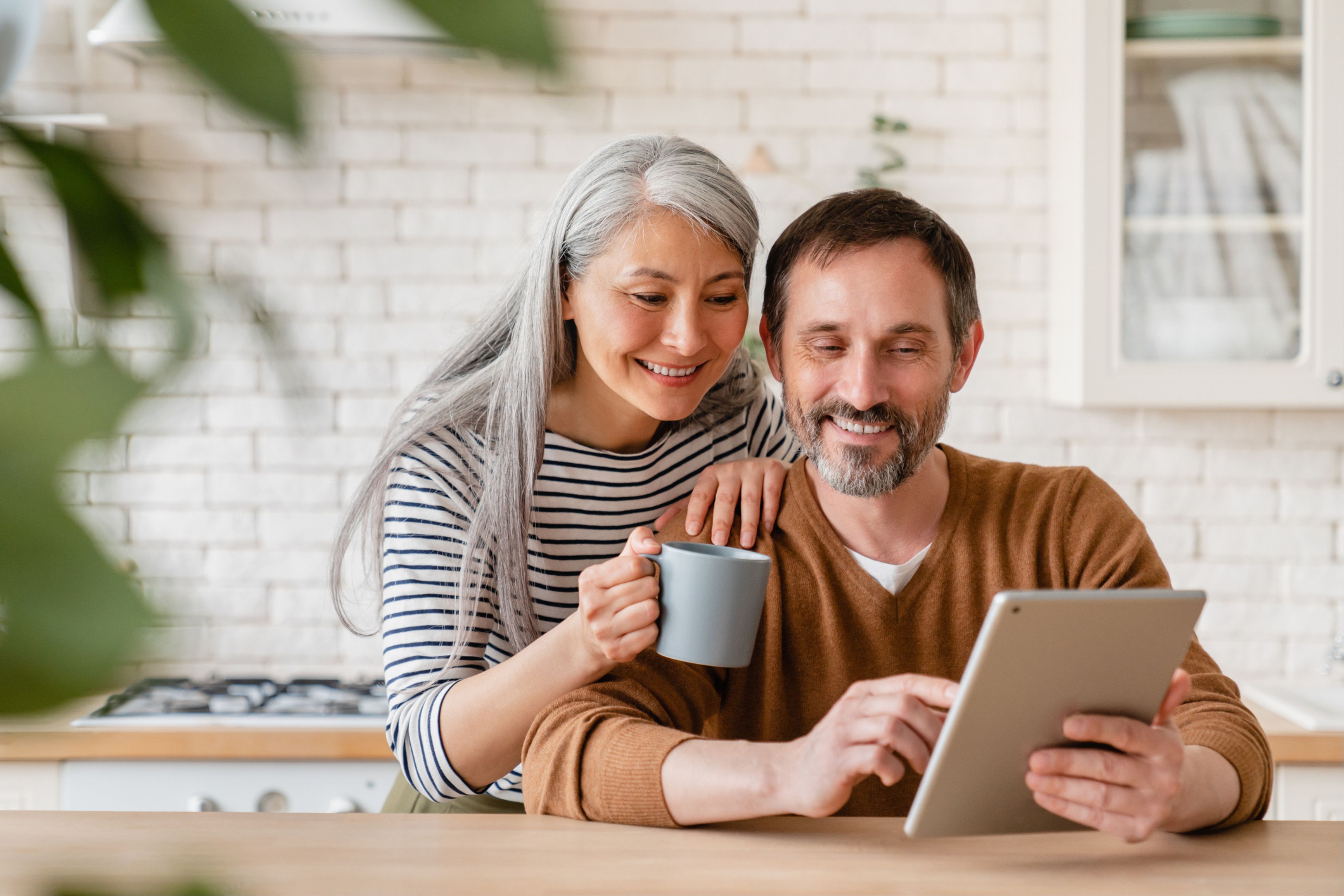 A couple checks out the TownSq and Village Management HOA software.