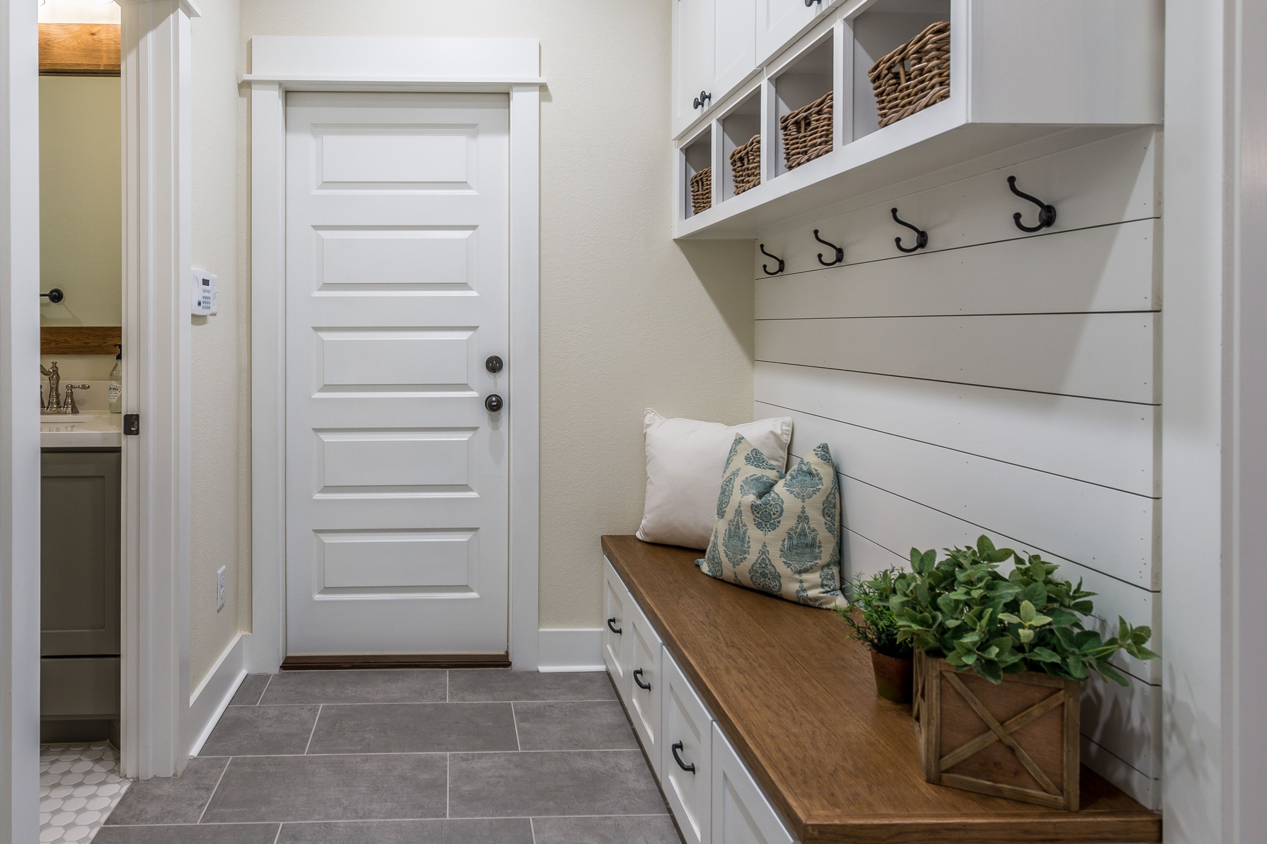 An organized hallway in a household that has conquered clutter