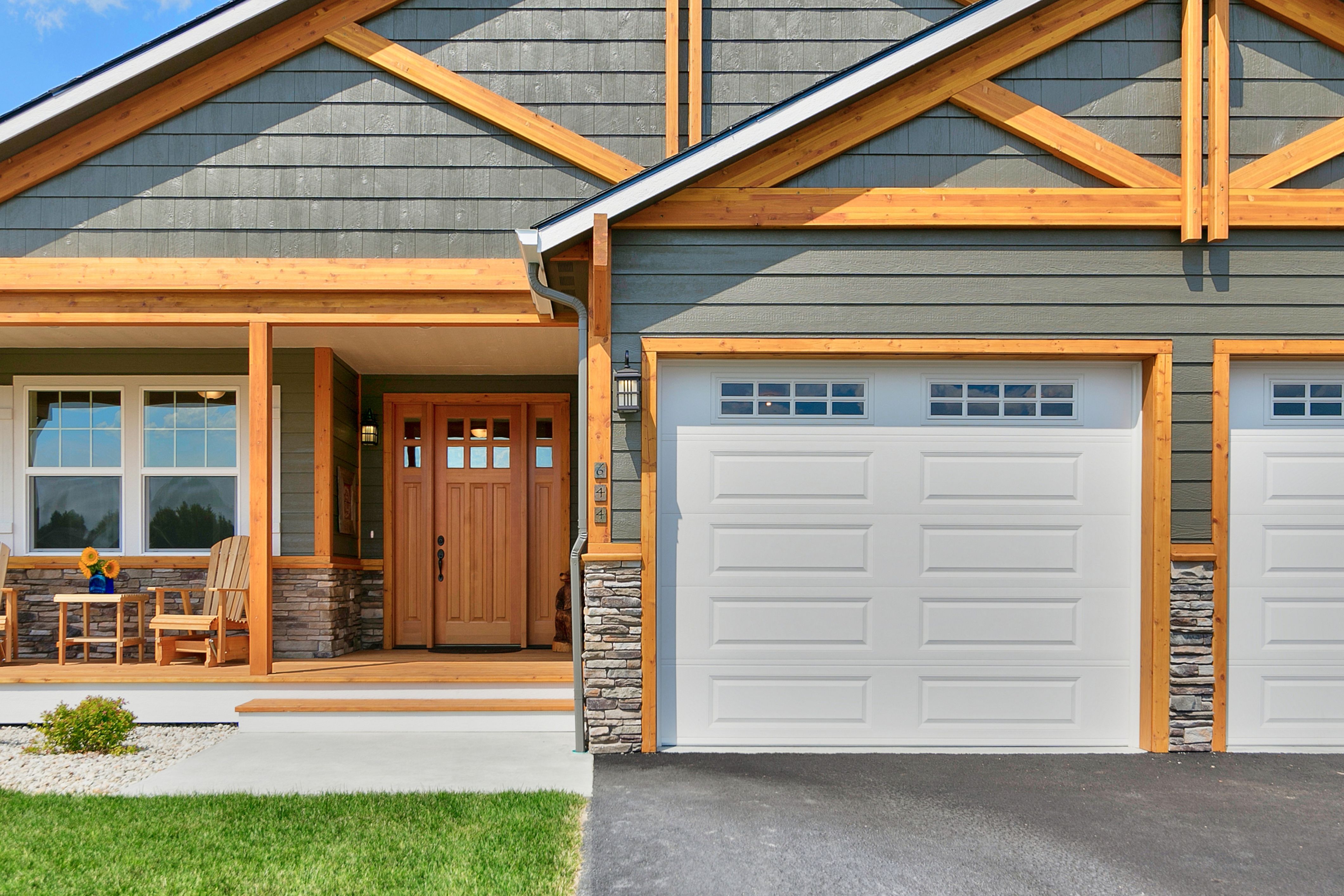 The front of a house with a garage that's ready for fall organization can be seen.