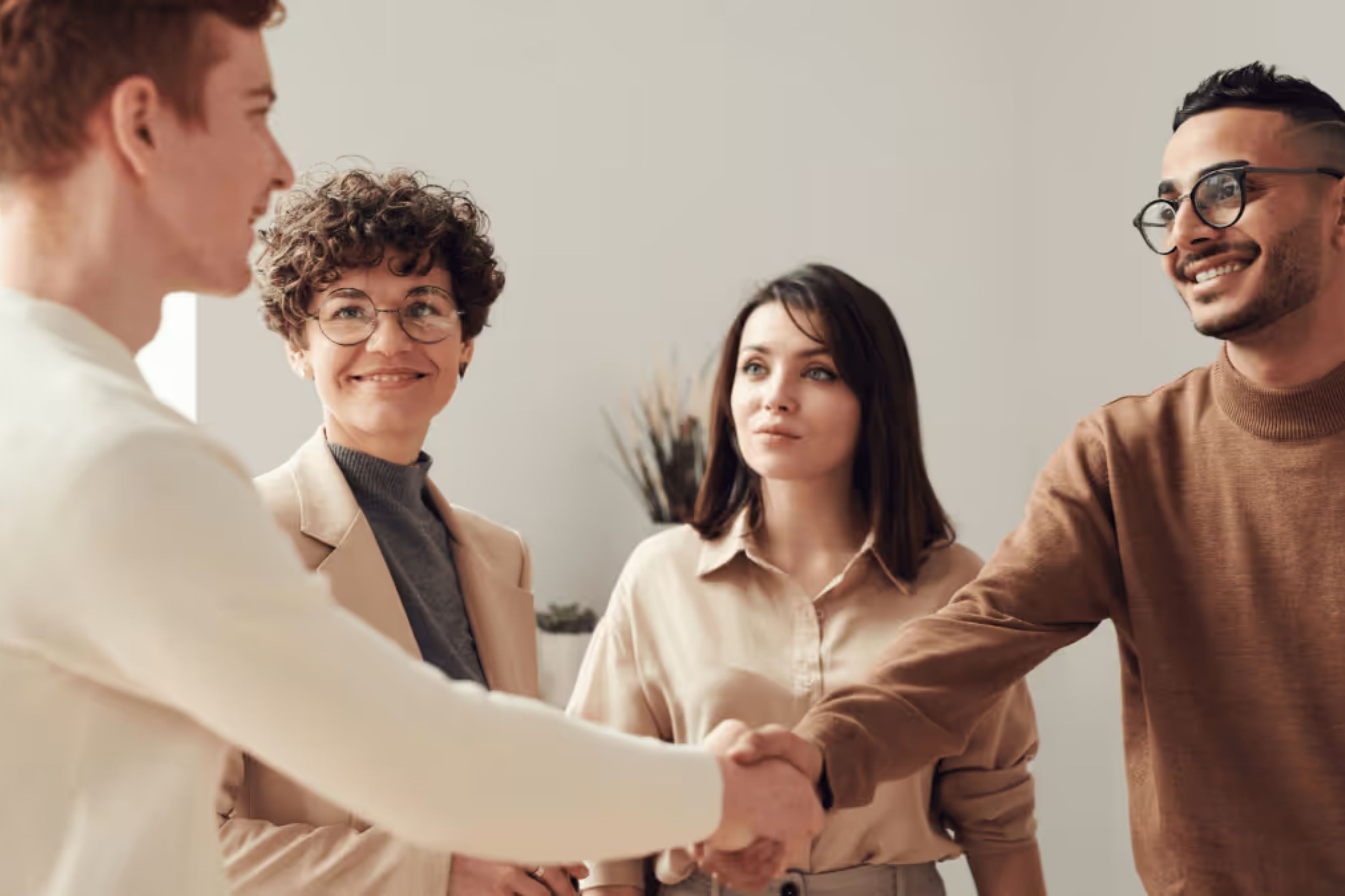 HOA board members share a handshake.
