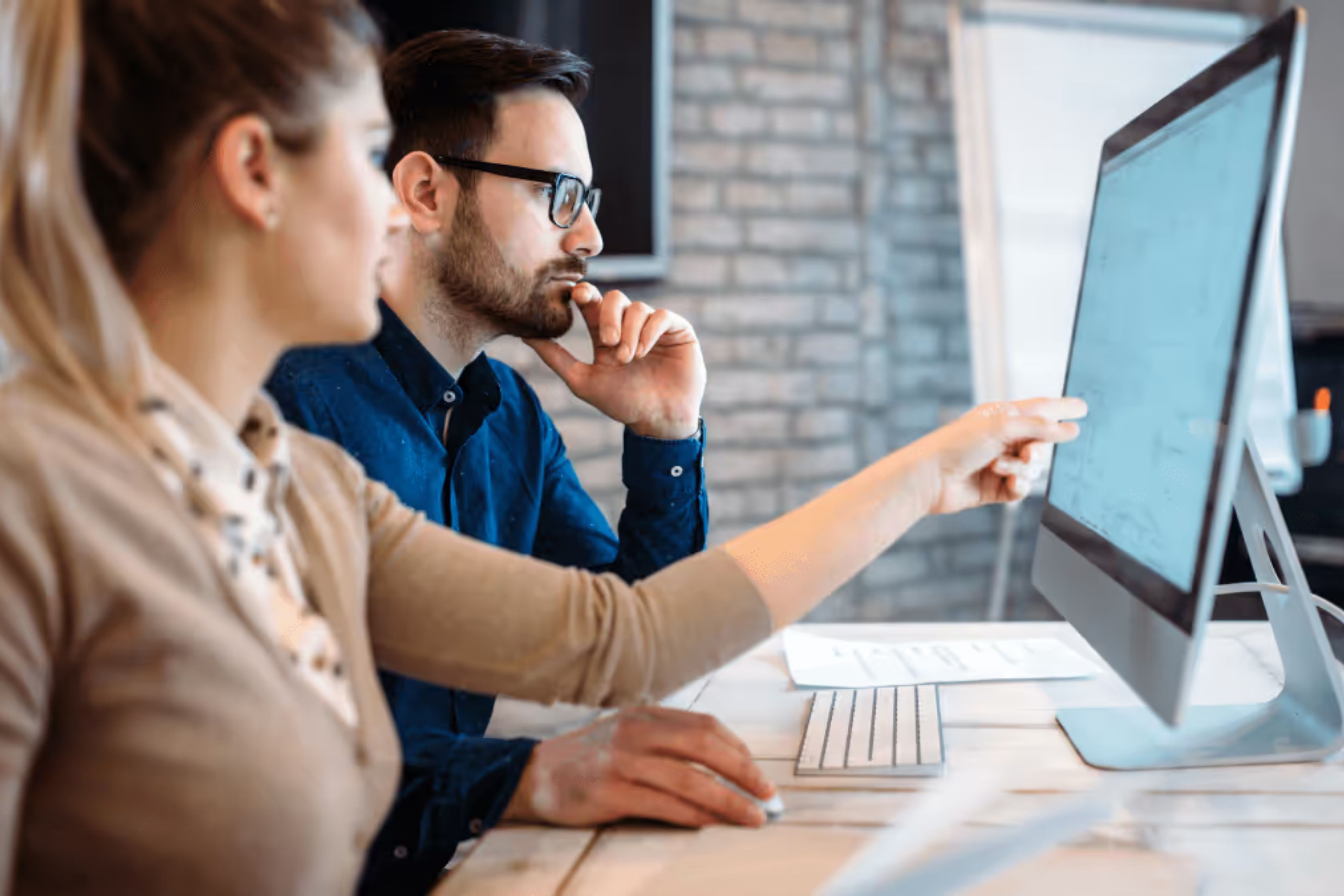 Two HOA community managers using HOA software to manage their community.