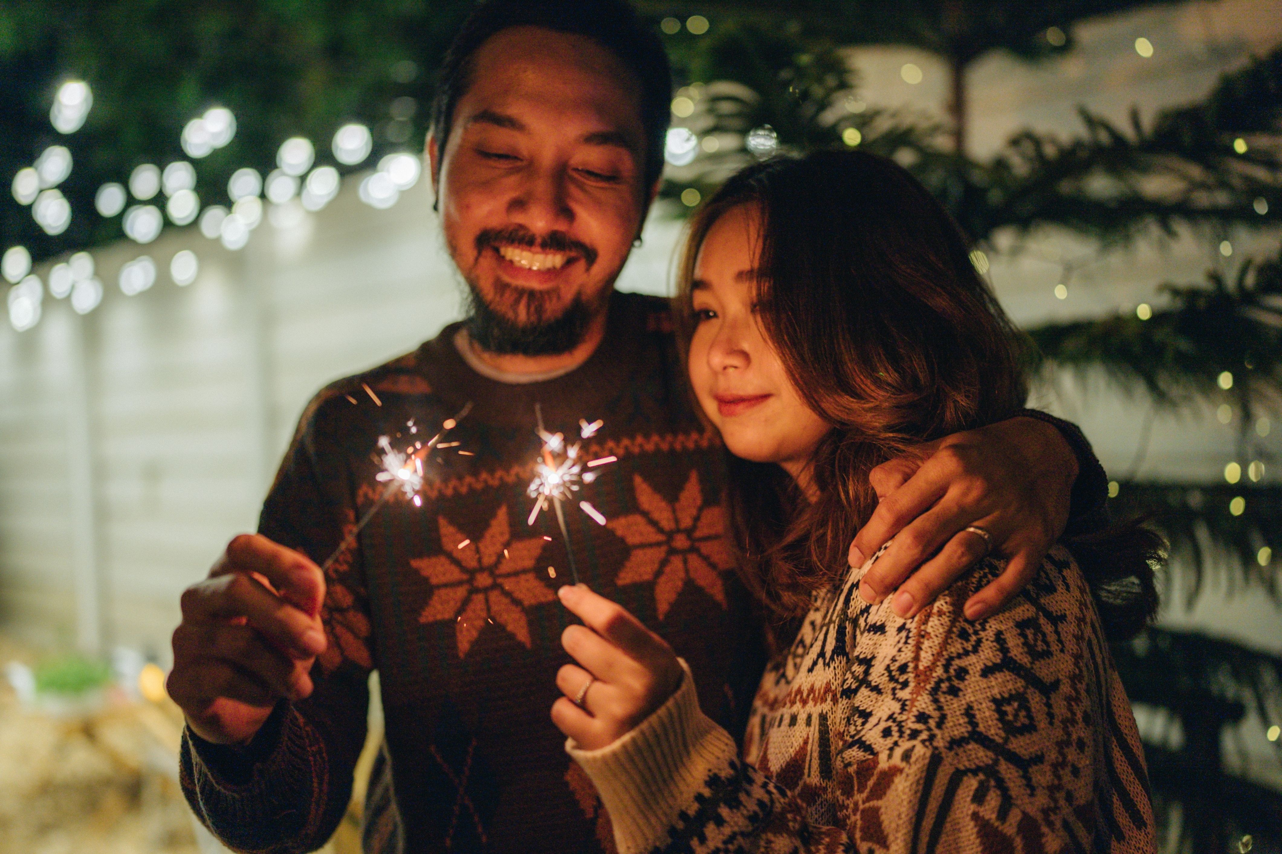 Two HOA residents make their New Year's Resolutions amidst fireworks.