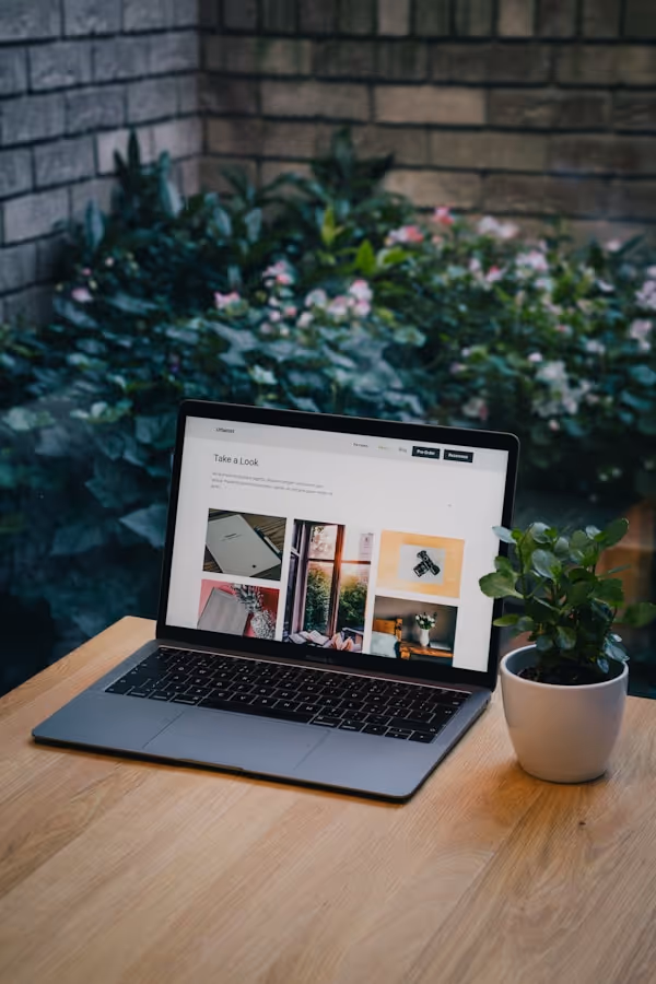 Minimalist office setup with laptop and desk representing Quarks Studio workspace