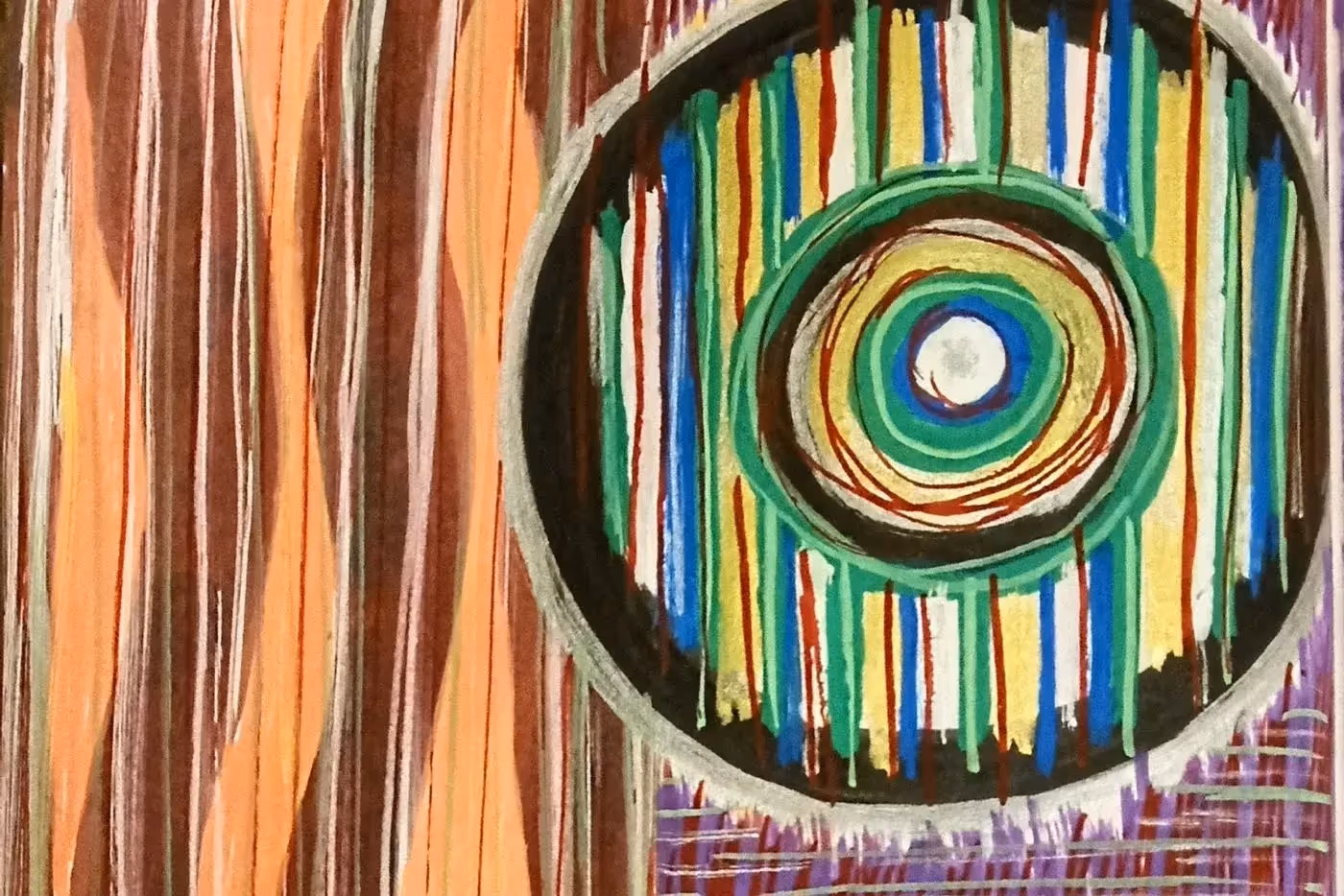 Abstract artwork. Straight brown and orange lines on the left A circle with a smaller circle on the right in blue, yellow, and green.