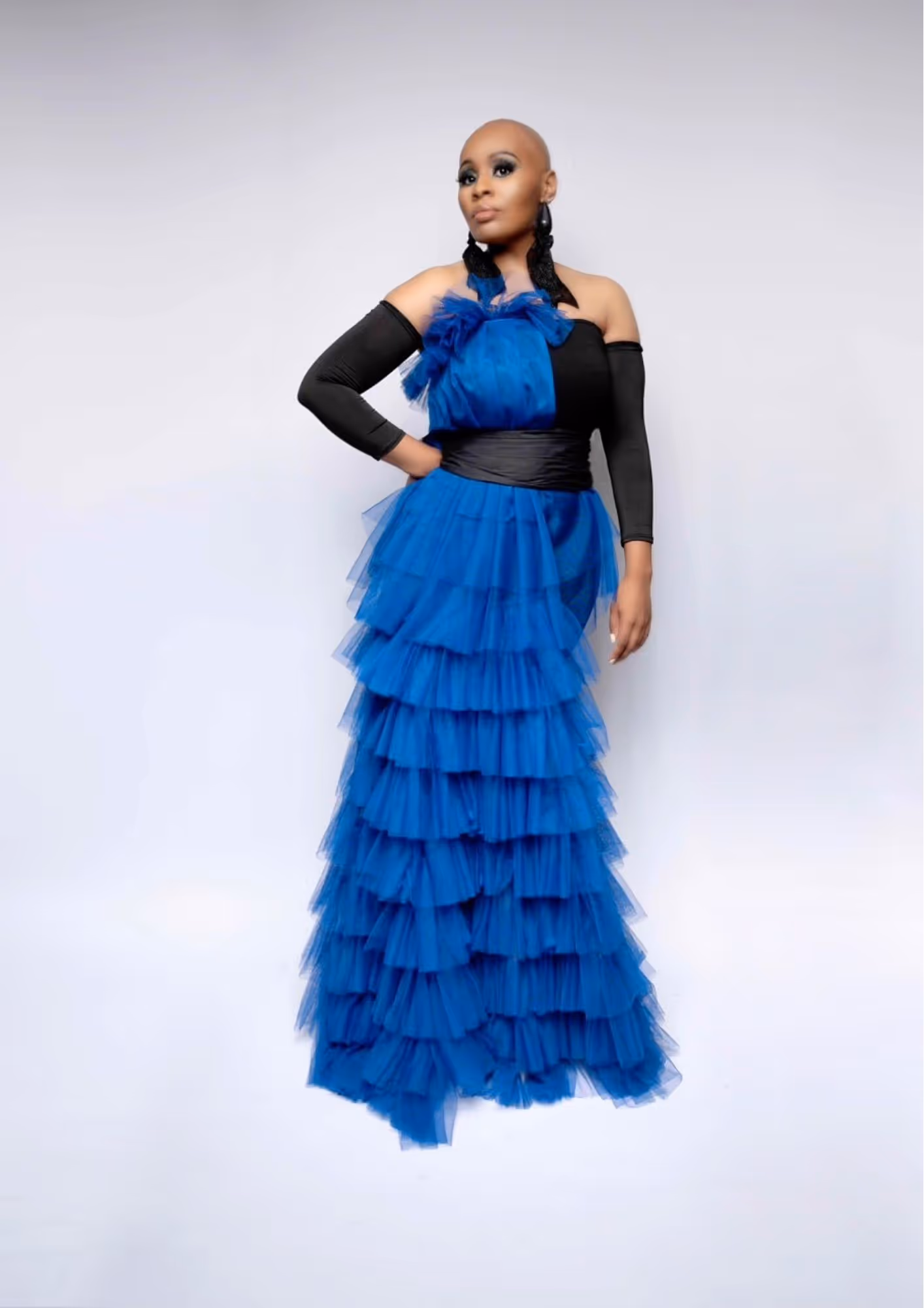 Ayanna Davis posing in a blue dress.