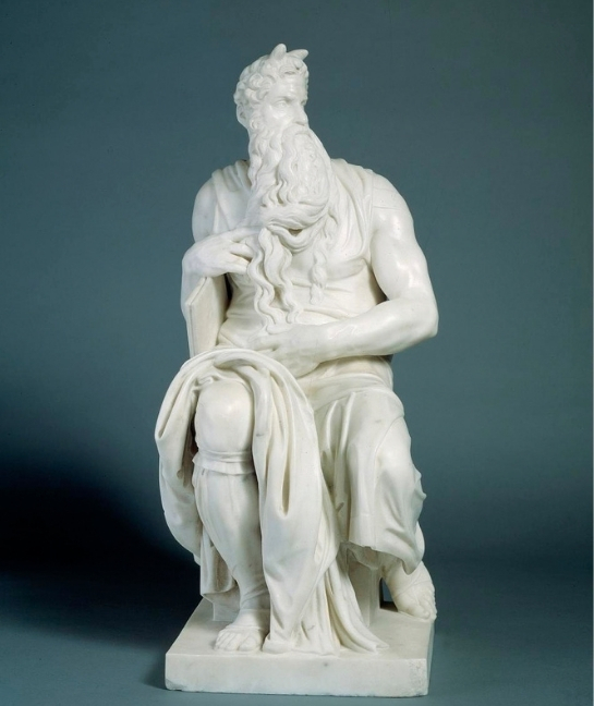 White marble sculpture by Edmonia Lewis after Michelangelo's Moses, a seated, bearded figure holding a tablet.