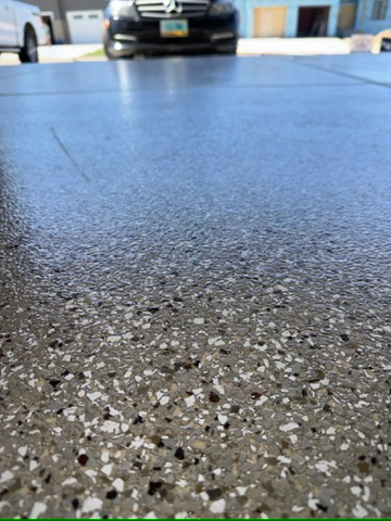 Metallic epoxy flooring in finished residential basement Bismarck ND