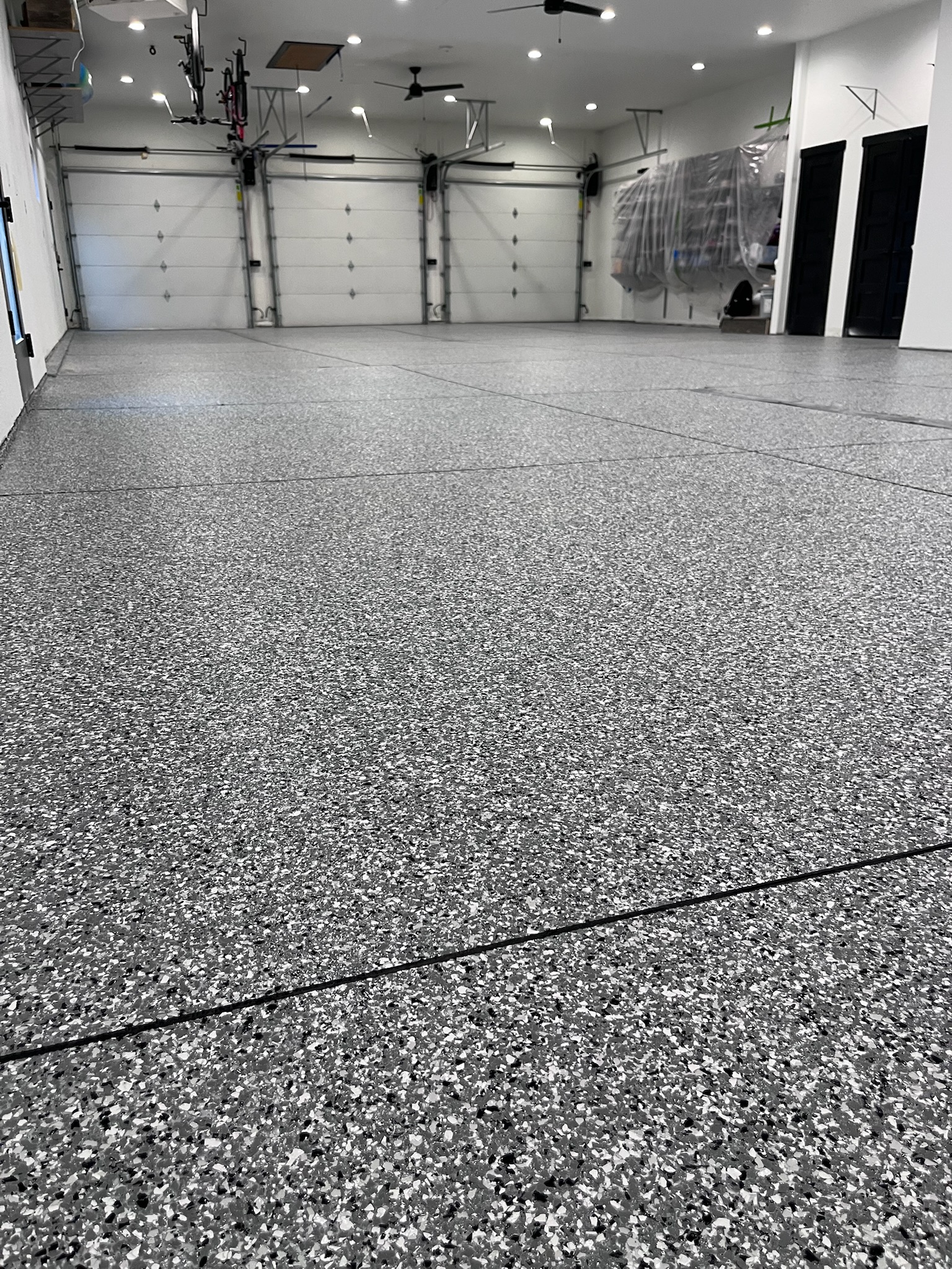 Metallic epoxy flooring in finished residential basement Bismarck ND