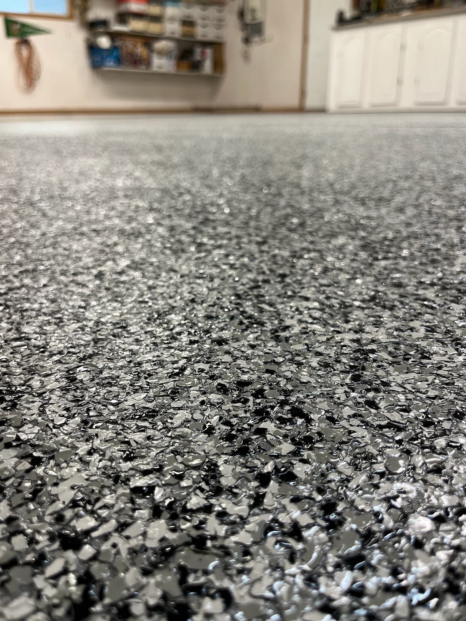 Metallic epoxy flooring in finished residential basement Bismarck ND