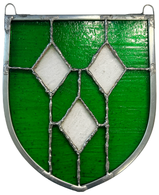 Stained glass shield with green background and three clear diamond shapes outlined in lead came.
