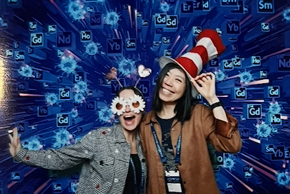 Two Teiko employees in costume at a conference booth