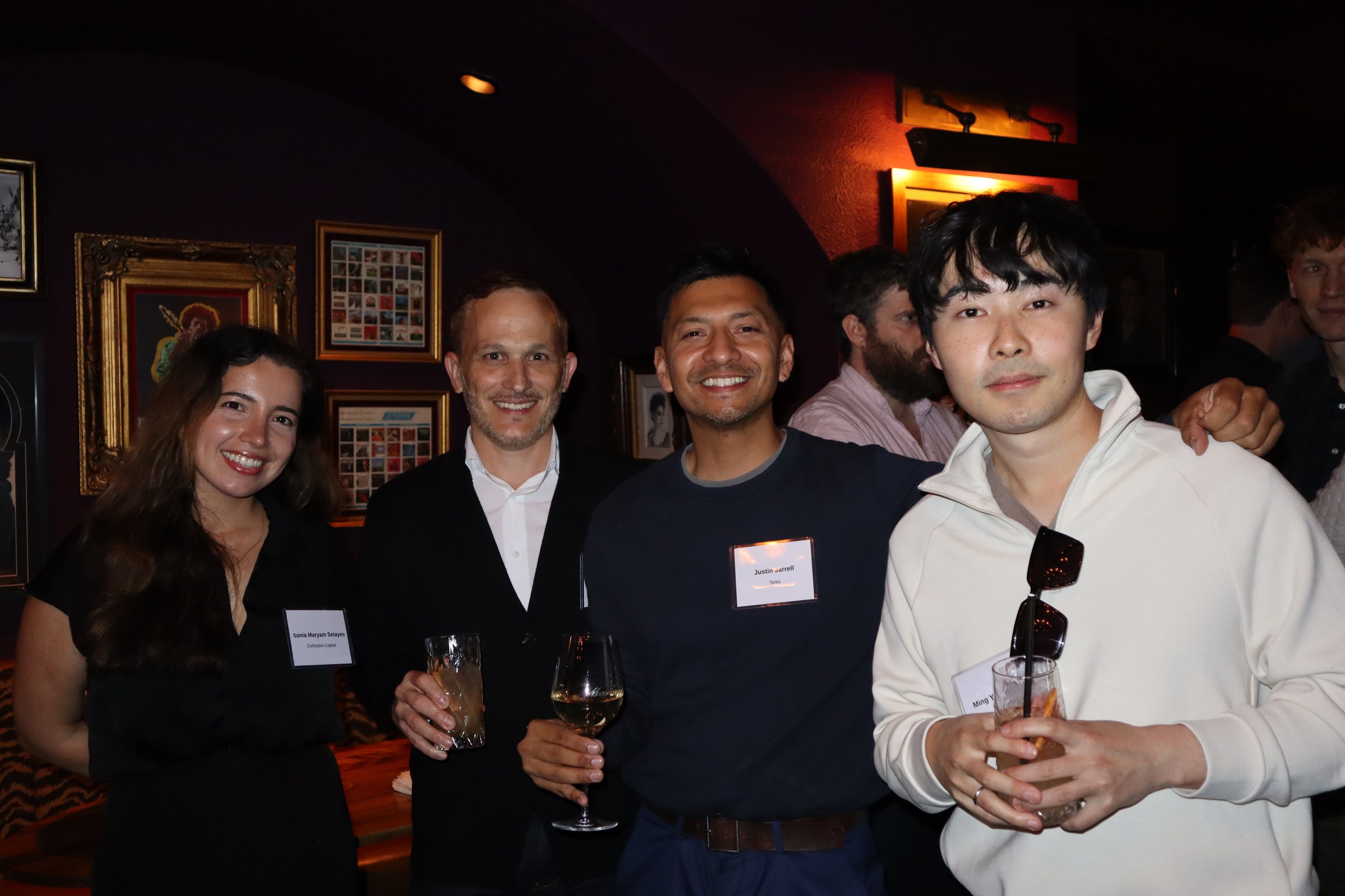 Justin and teammates with drinks at Teiko's Chief Scientist dinner