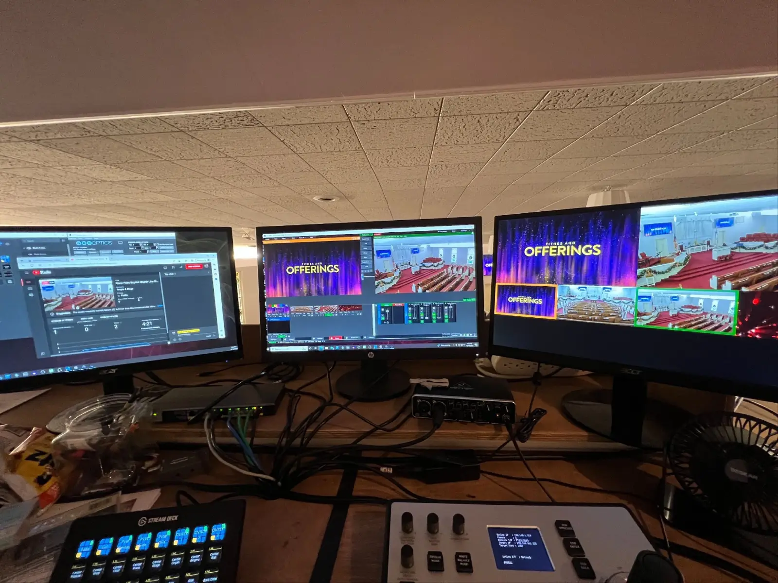 Church livestream production station with three monitors showing live video switching software and camera feeds