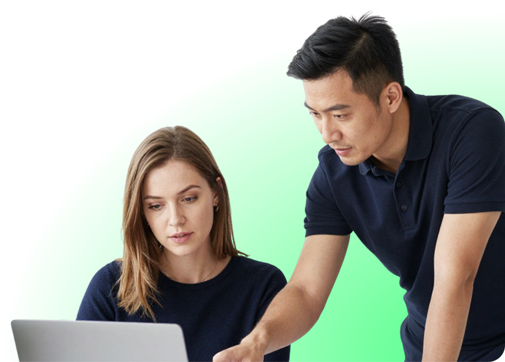 Man and woman focused on laptop screen, man pointing at it with green graphic background.