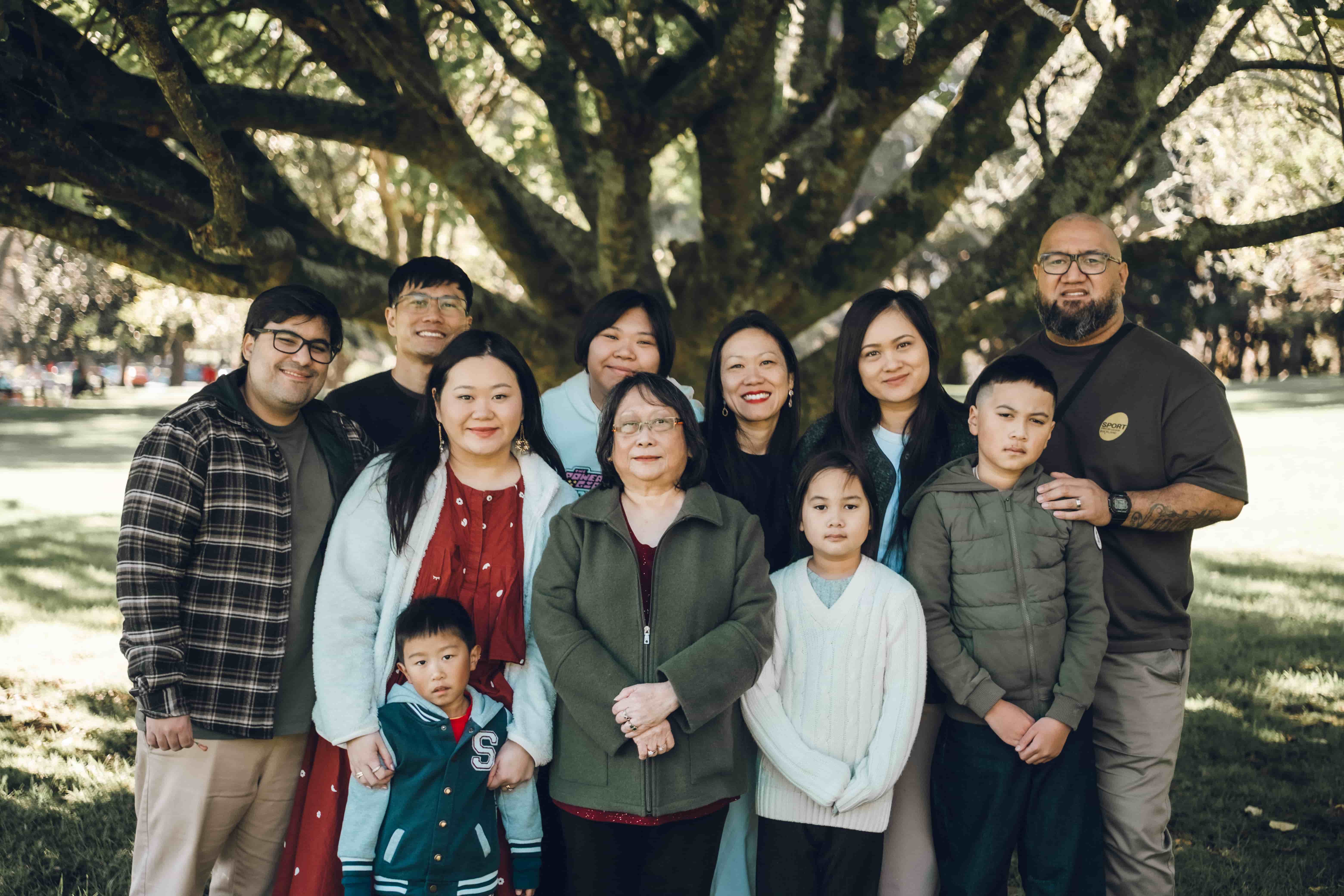 The whole extended family gathered under a big tree in Cornwall Park