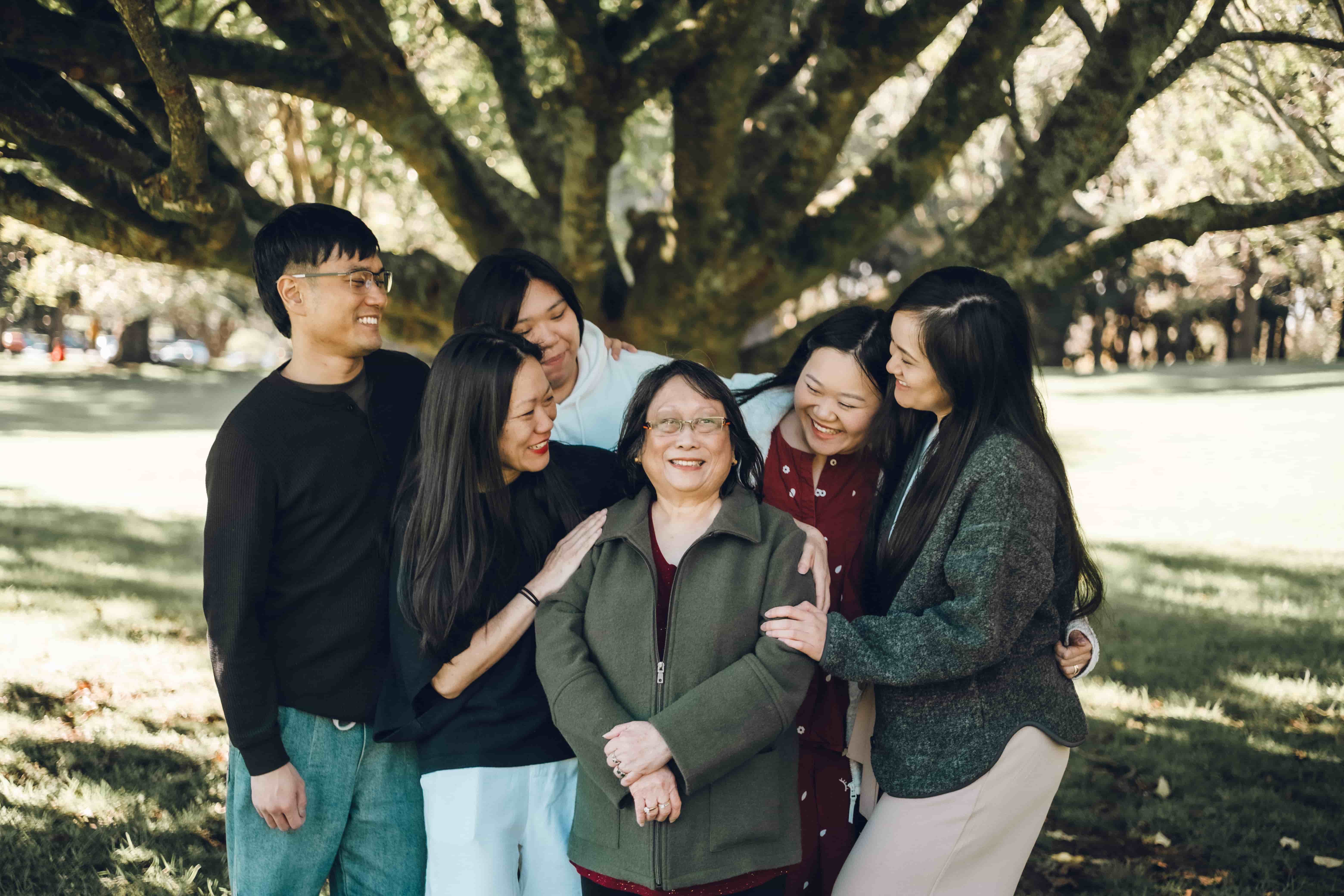 Grandmother surrounded by her smiling adult children
