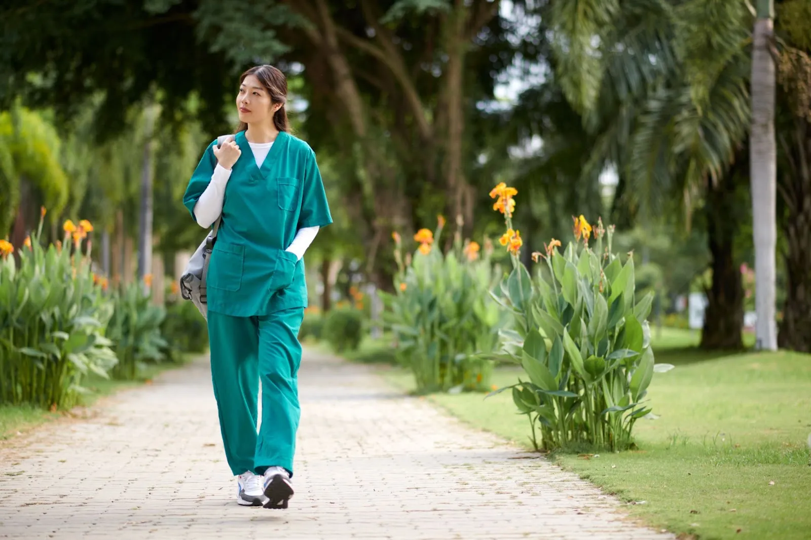 Caregiver taking a mindful walk outdoors for self-care, promoting physical activity and stress relief as part of self-care for caregivers.