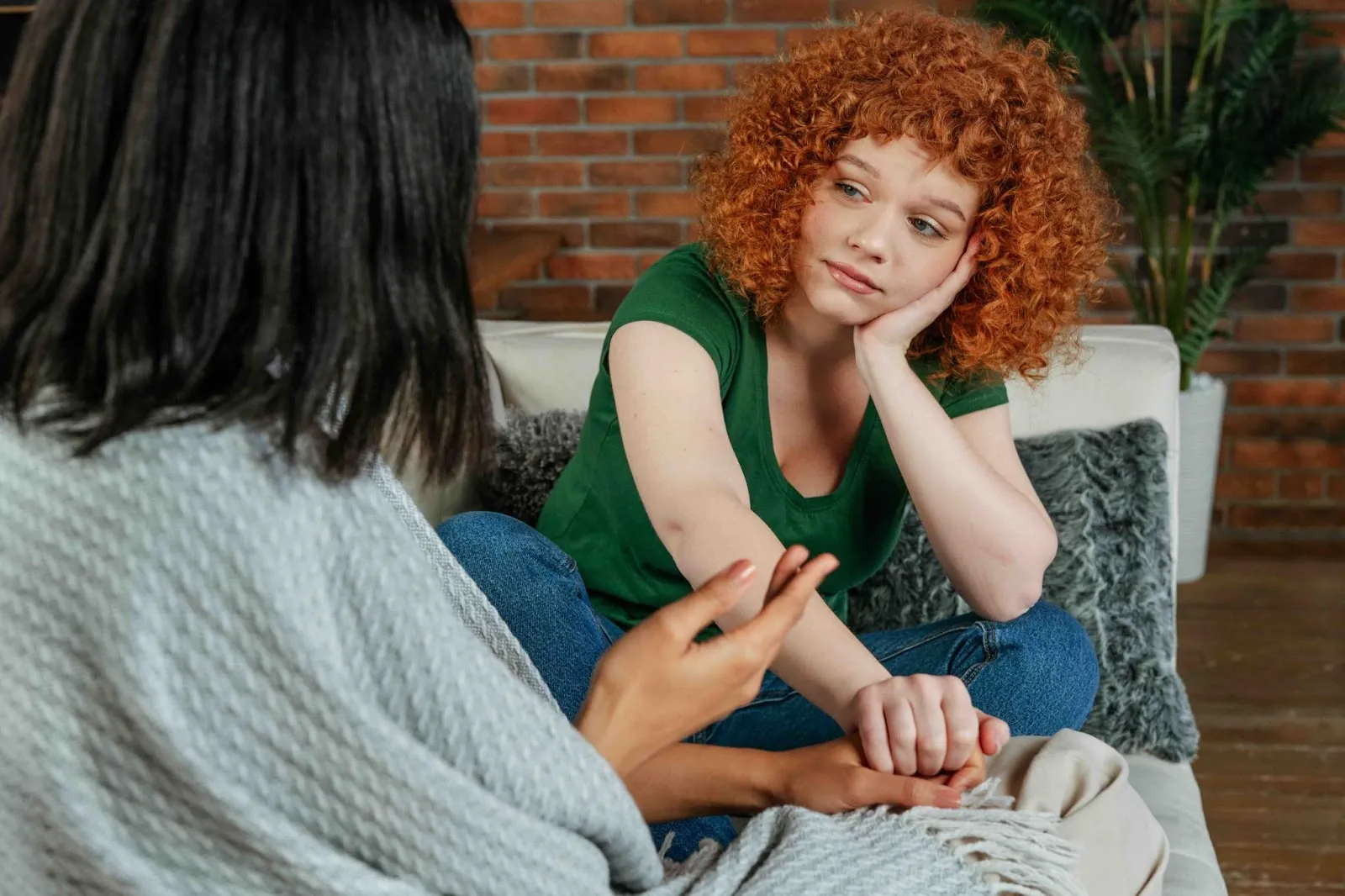 A supportive friend listens with empathy, showing grief support and demonstrating how to help someone who is grieving by being present and attentive.