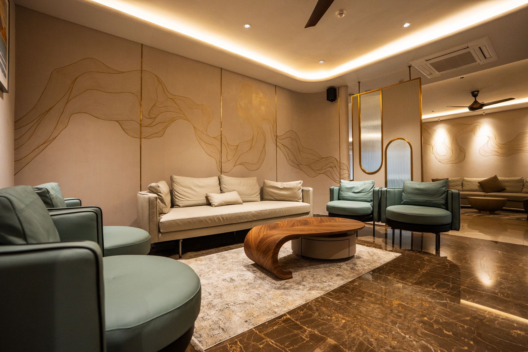 Elegant dining area with a round table and comfortable chairs, showcasing Elementz interior design