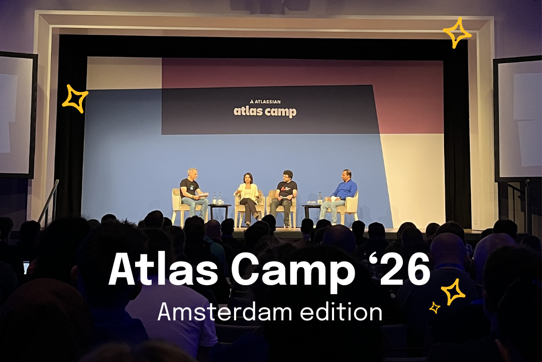 Panel discussion on stage at Atlas Camp 2026 in Amsterdam with four speakers seated in front of a large audience.