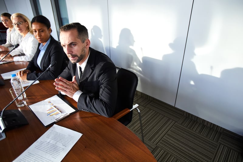 Board members reviewing executive compensation data