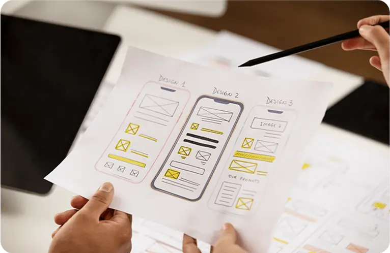Wireframe being discussed in hand.