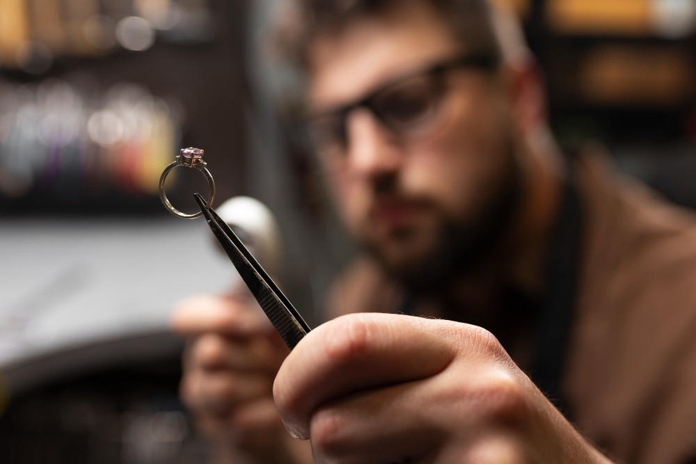 professional jewellery expert valuing ring 