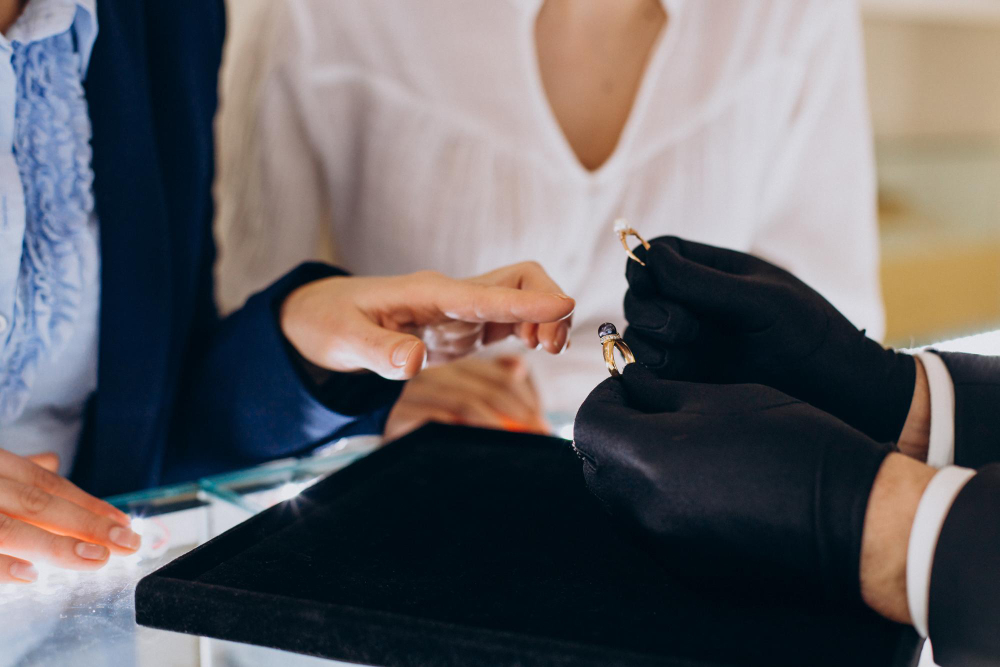 Couple at jewelry store choosing a ring together