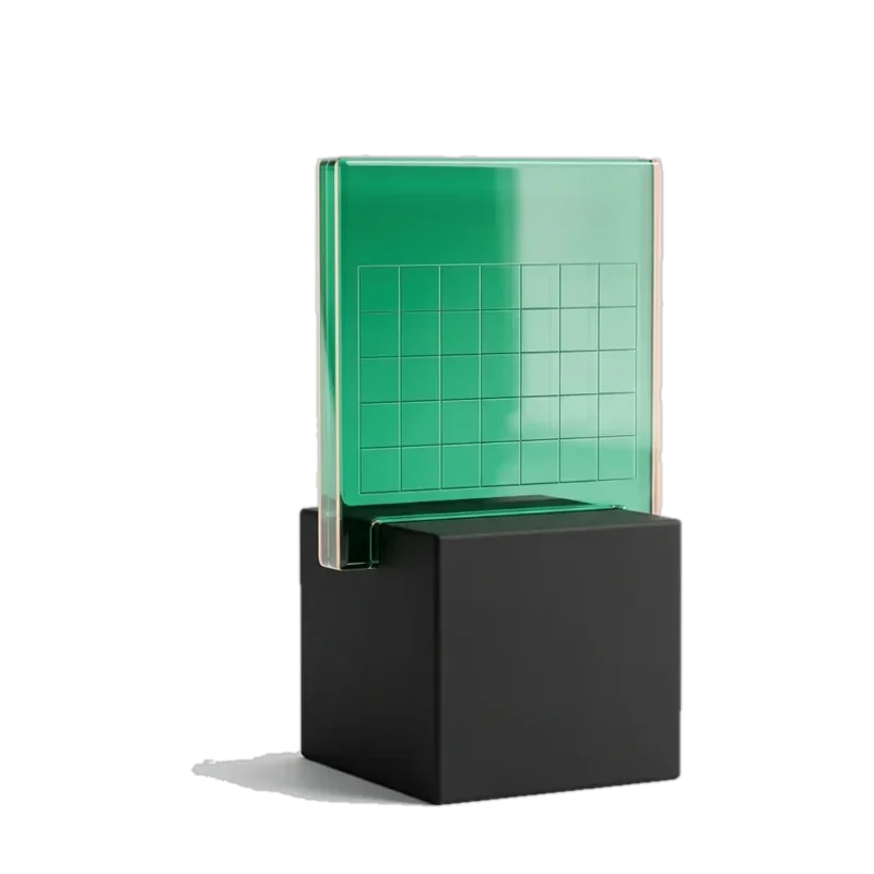 Green glass calendar on a black base