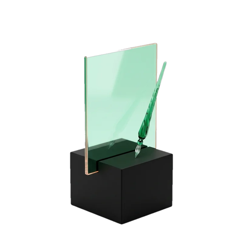 Green glass sheet and pen on a black base