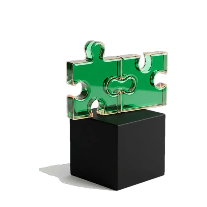 Two green glass puzzle pieces joined on a black base