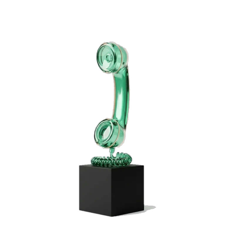 Green glass phone handset on a black base
