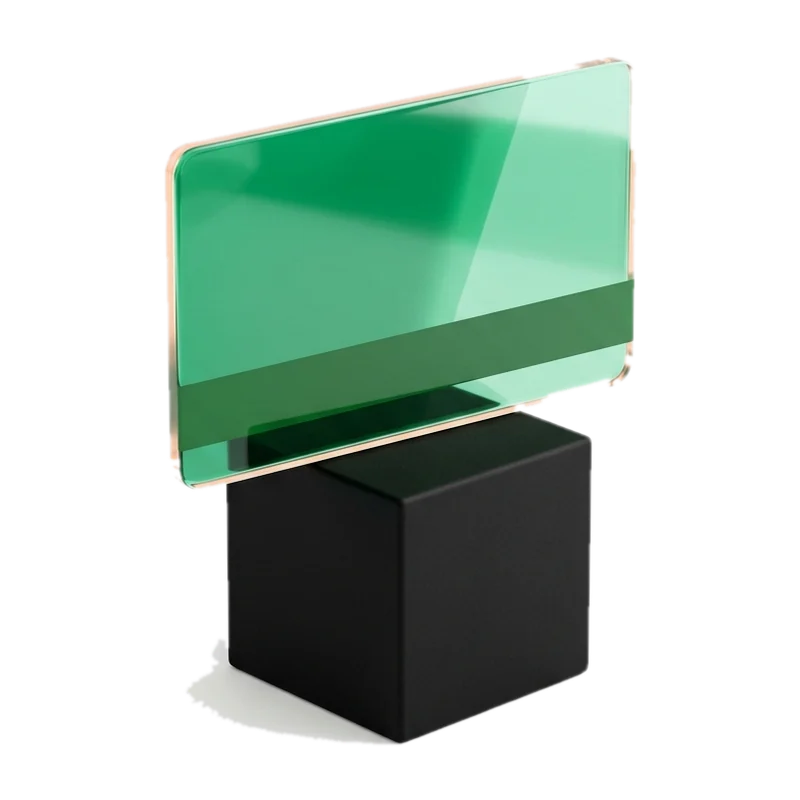 Green glass payment card on a black base