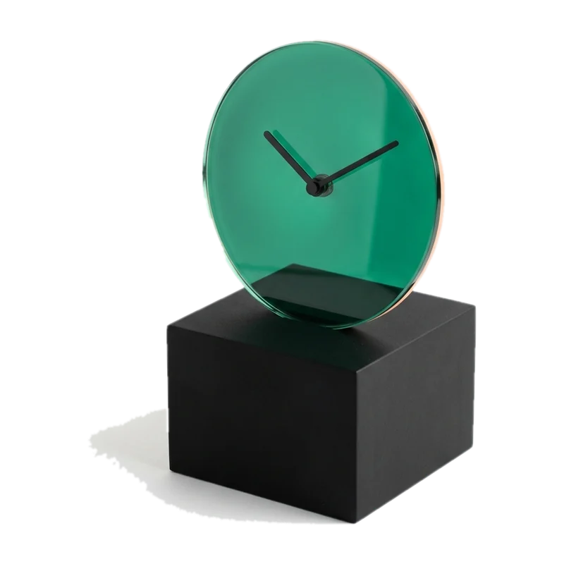 Green glass clock on a black base