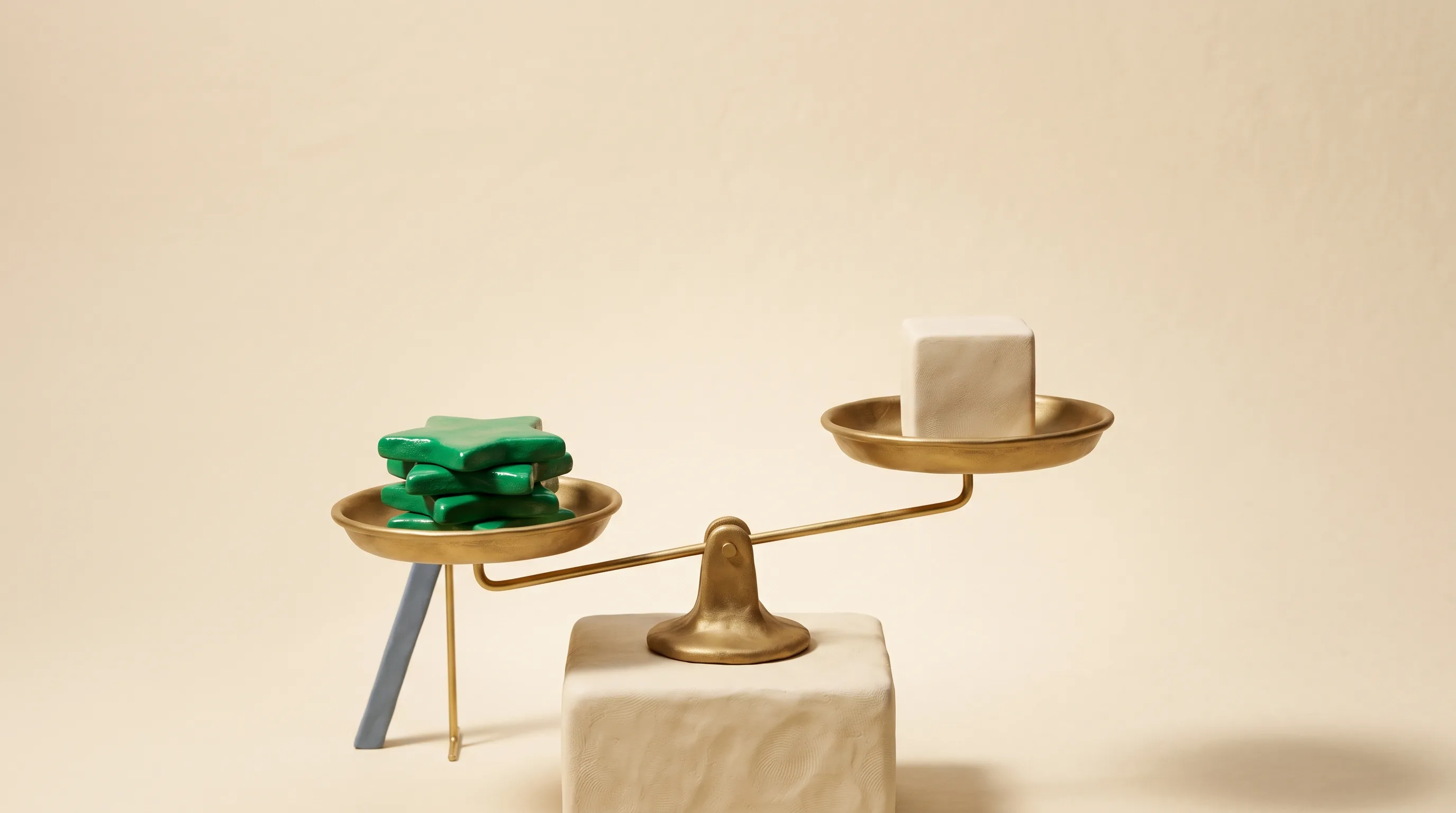 Clay brass scale weighing emerald star medallions against a plain cream cube, illustrating how a dental SEO Myrtle Beach plan is judged by high-value booked cases