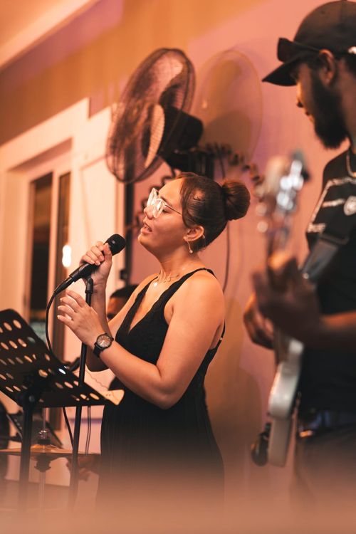 Young diverse couple having lunch with junk food