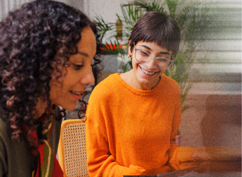 Two people collaborating with tablet, representing talent acquisition teams.