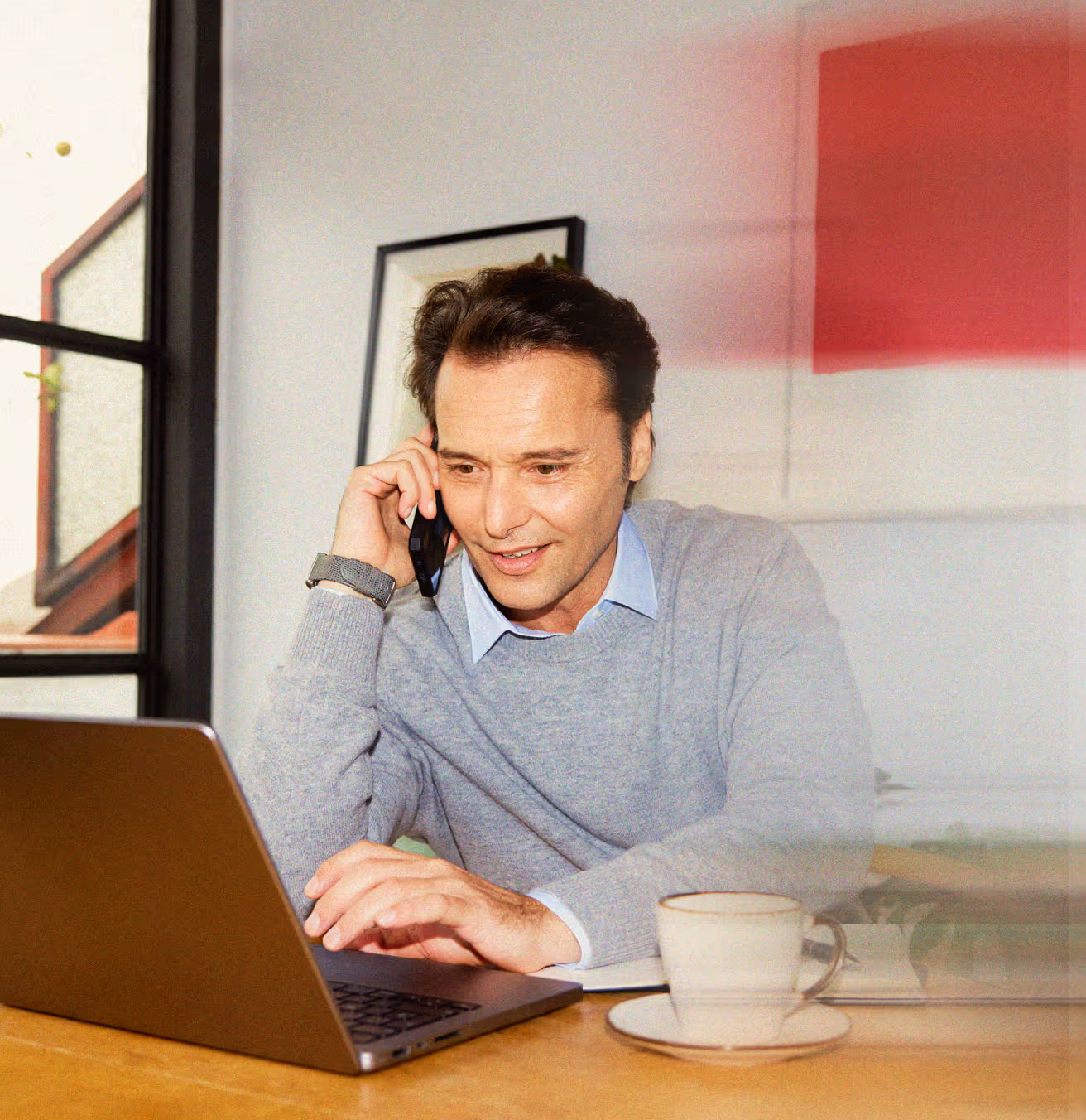 Person on a call while working on laptop, representing recruiters building client trust.