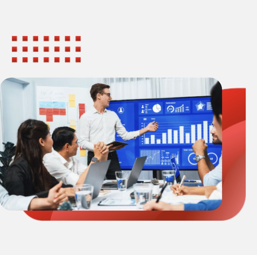 Team meeting featuring a digital display of business growth metrics and data analytics