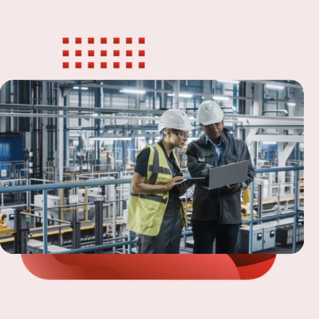 Technical support team using a laptop in a manufacturing plant, representing integrated IT services for industrial operations.