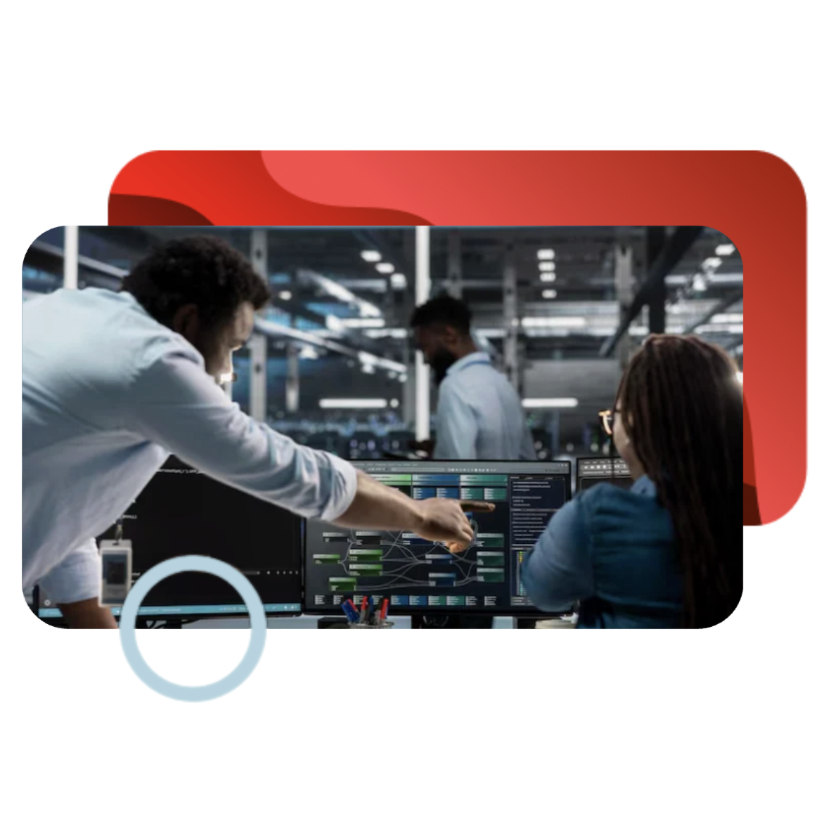 IT professionals analyzing system metrics and data flows on computer monitors in a modern operations center.