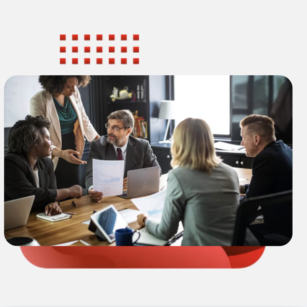 Team members in a meeting, reviewing documents together