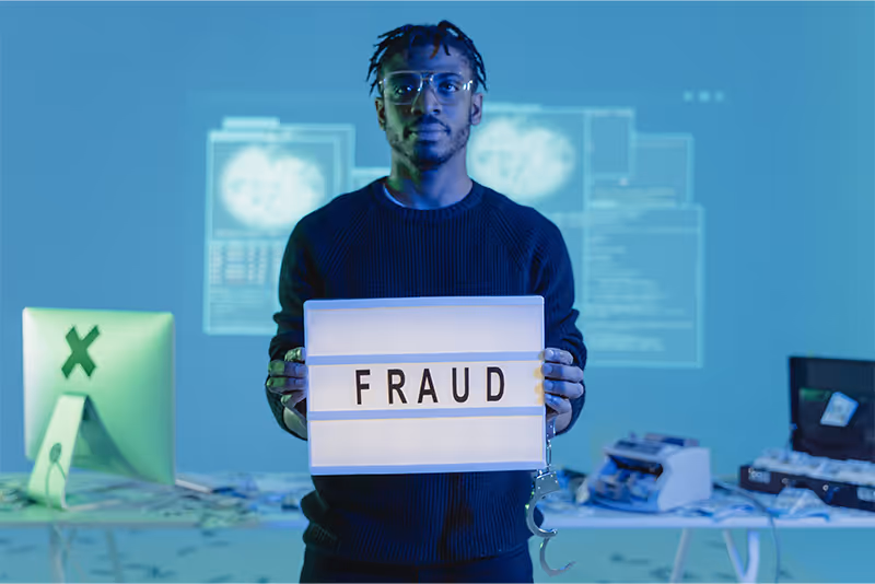 stock photo man holding lighted sign with word fraud