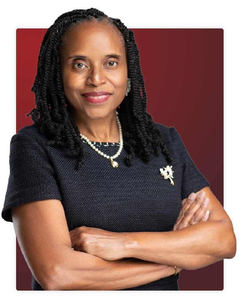 janice allen jackson standing in front of a gradient background