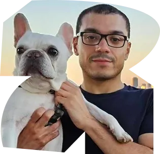 A man holding a small white dog. - ÜberStrategist Images