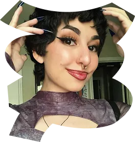 A woman with a nose ring and lipstick smiles for the camera. - ÜberStrategist Images