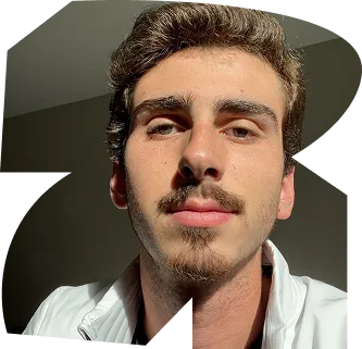 A man with a beard and mustache is wearing a white jacket. - ÜberStrategist Images