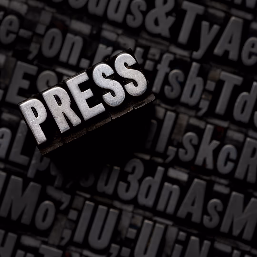 A black and white photo of a press button. - ÜberStrategist Images